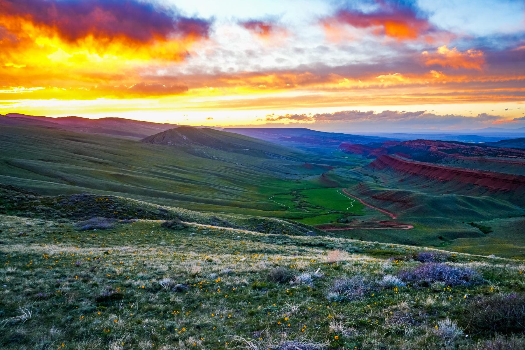 Sunset over Red Canyon, WY from Sand Draw Road near Beaver Rim, May 2025.  Photo by Libby Ann.
